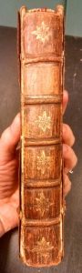 This is an artifact, created in 1728, that I can hold (carefully) in my bare hand! (Gold-tooled spine of British Curiosities)
